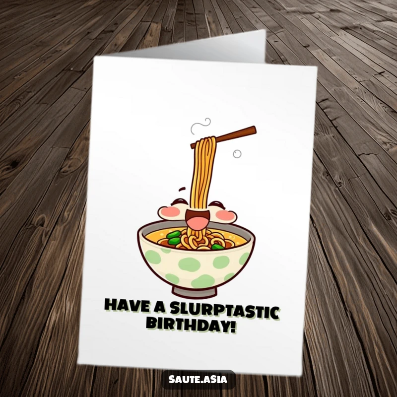 Funny Free Printable Birthday Card featuring a delighted ramen bowl character happily slurping noodles with rising steam.